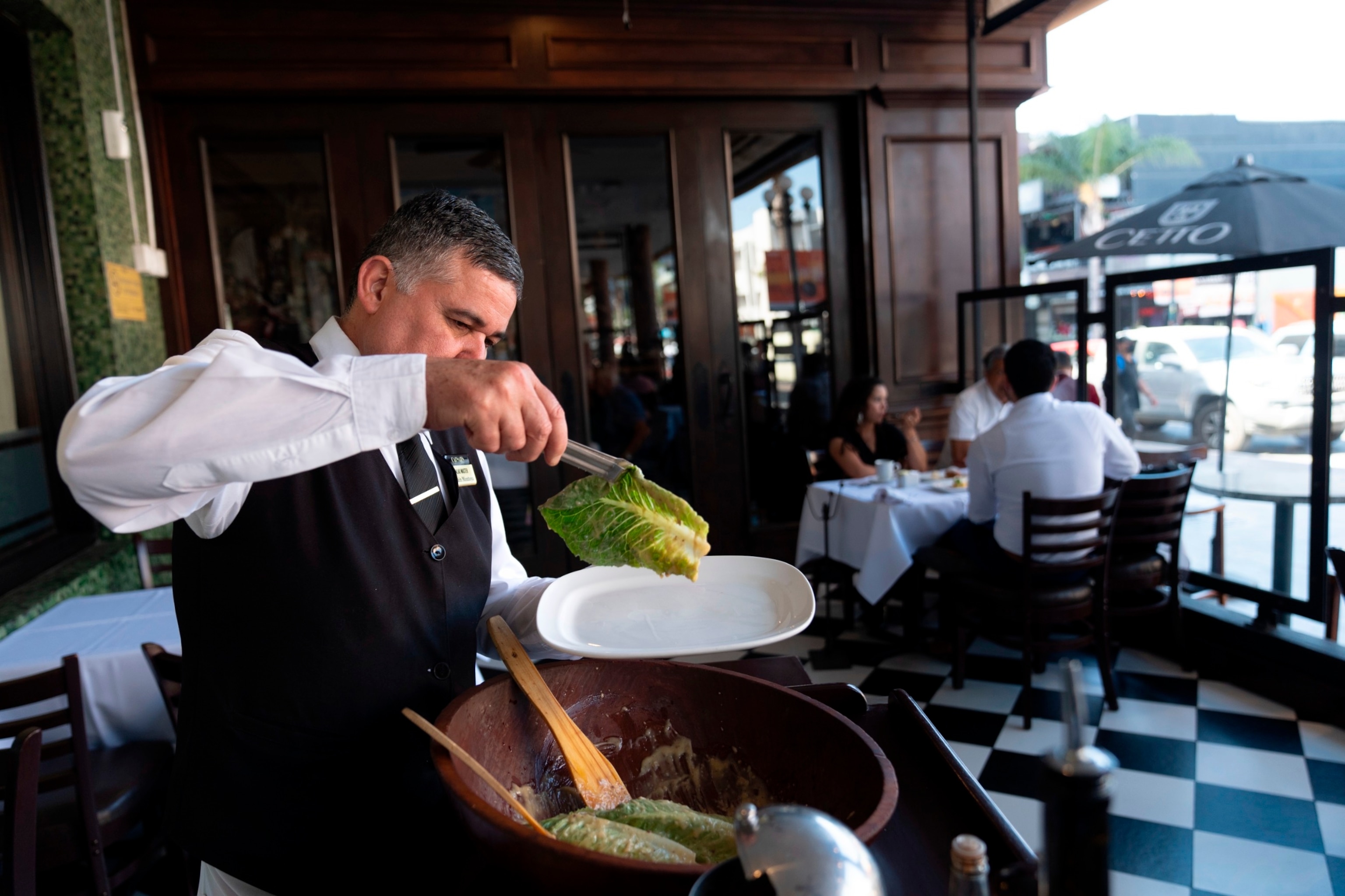 PHOTO: Salad Master Efrain Montoya prepares a Caesar salad at Ceasar's restaurant, June 27, 2024, in Tijuana, Mexico.