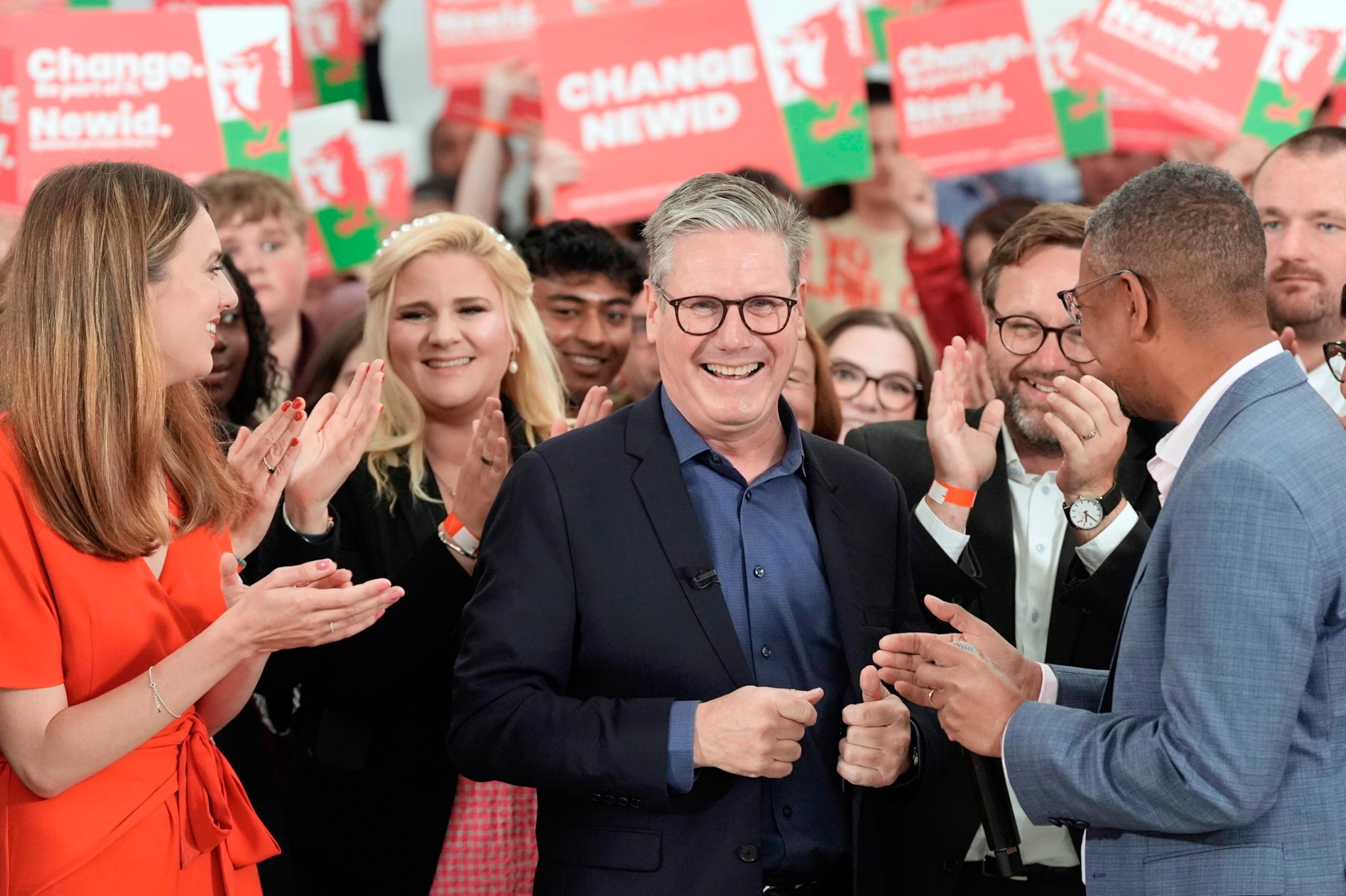 PHOTO: Labour Party leader Keir Starmer, center, speaks with First Minister of Wales Vaughan Gething, right, and and local parliamentary candidate for Carmarthenshire, Martha O'Neil, left, in Wales, Wednesday July 3, 2024.
