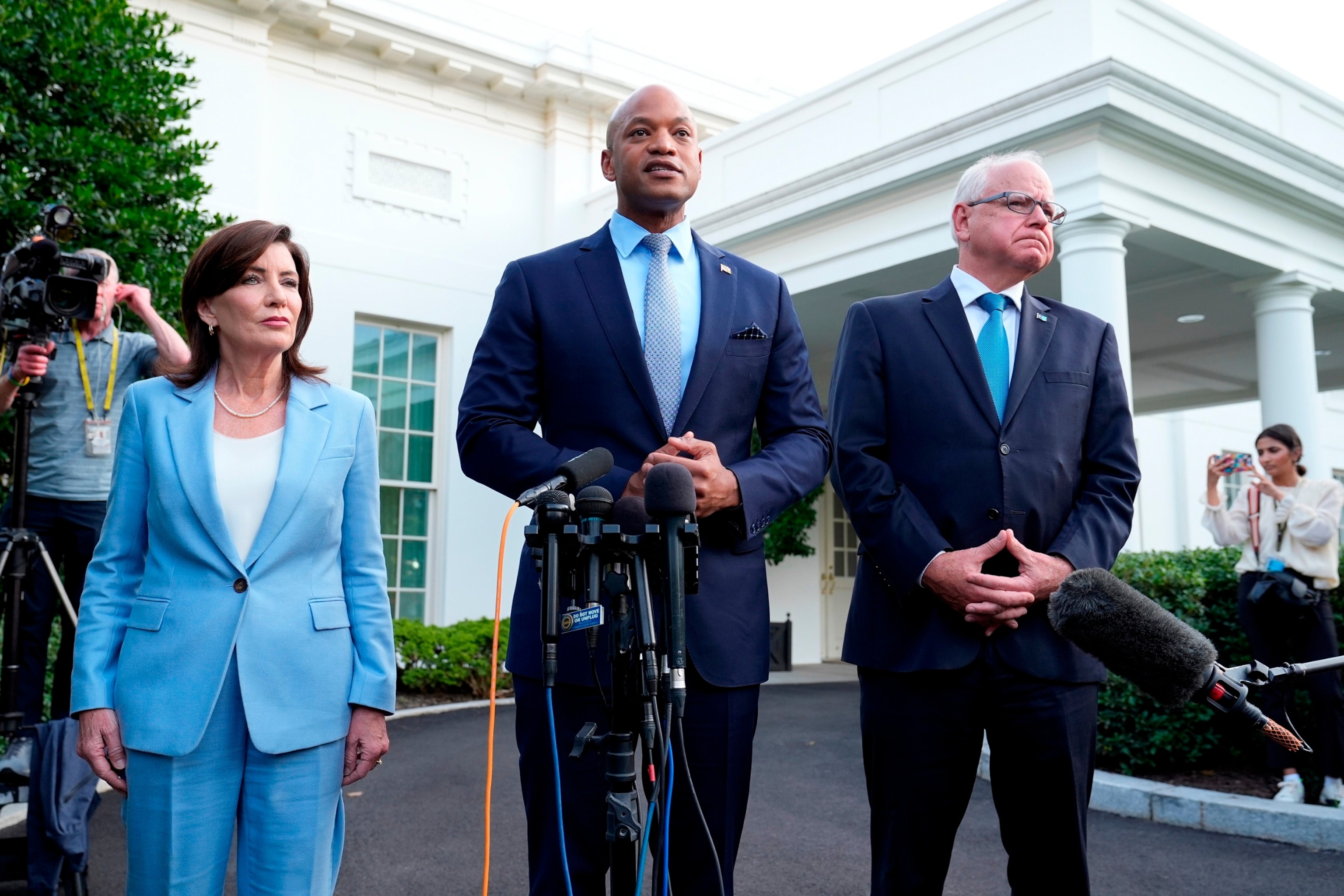 PHOTO: Maryland Gov. Wes Moore, center, standing with New York Gov. Kathy Hochul, left, and Minnesota Gov. Tim Walz, right, talk with reporters following their meeting with President Joe Biden at the White House in Washington, D.C., on July 3, 2024.